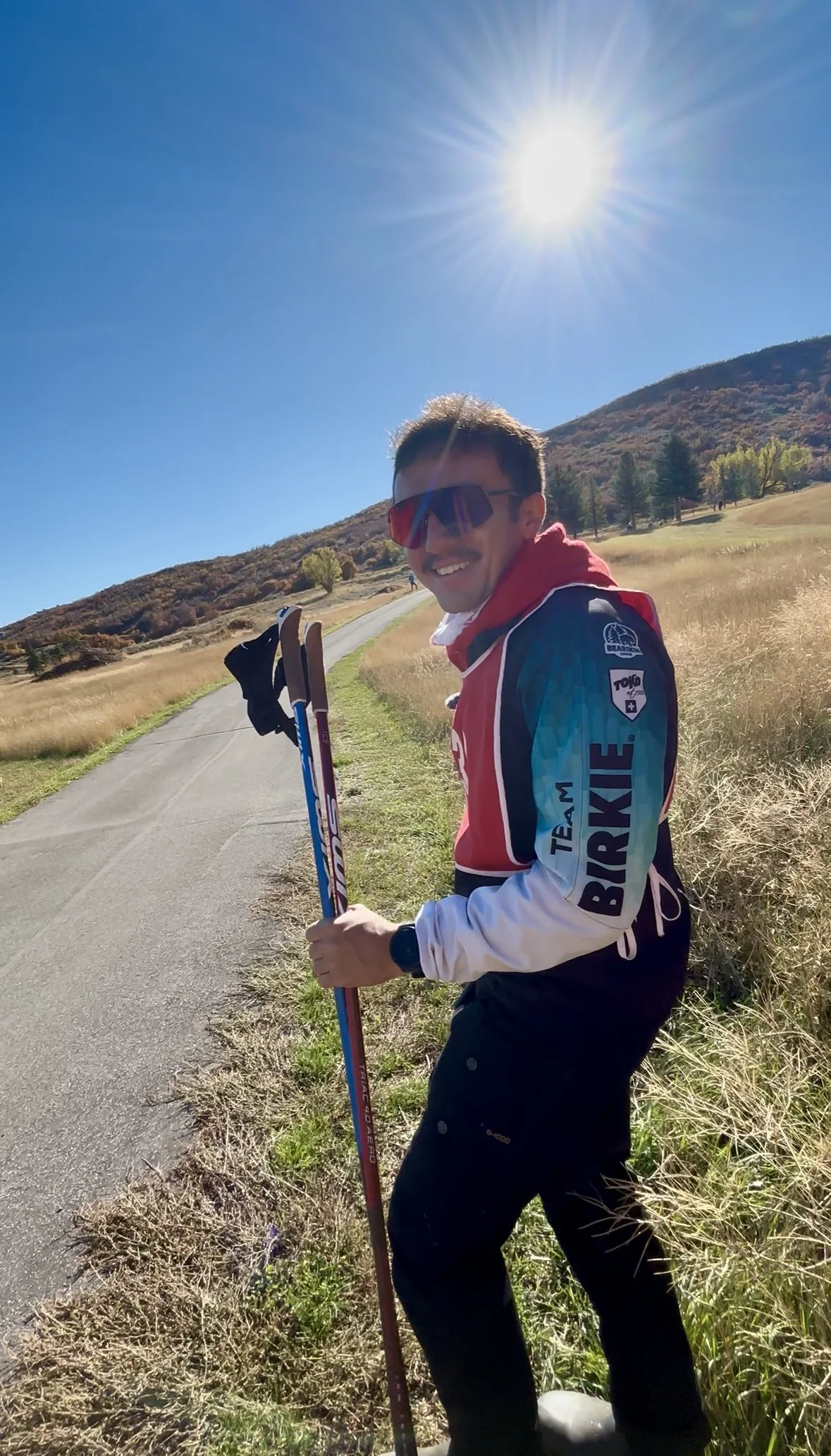 Jake Stiele outdoors with ski poles