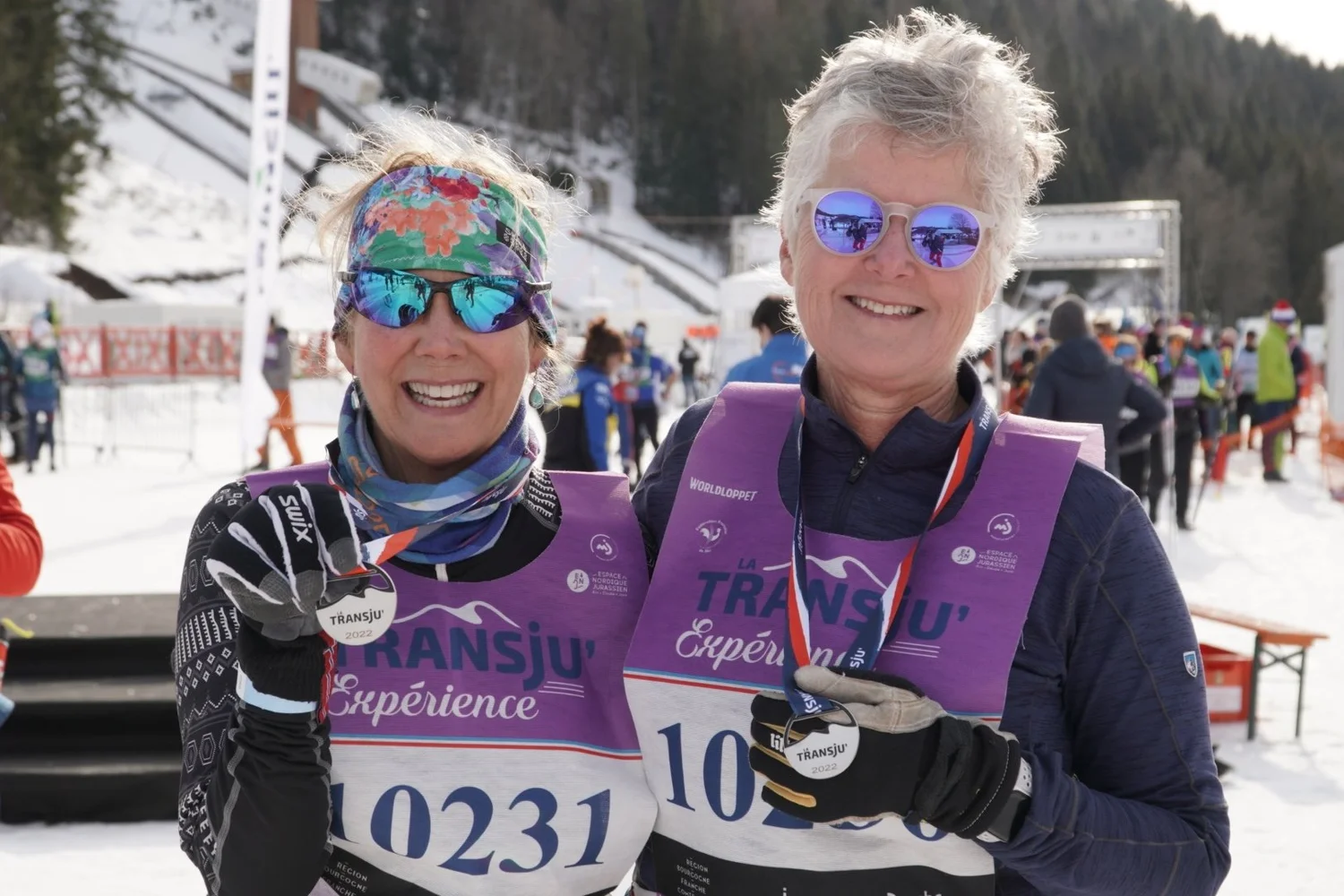 Two Lumi guests celebrating with medals at the Transju’ ski event in France