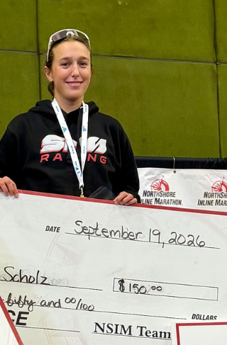 Gretta Scholz on the podium after winning the 2026 NorthShore Inline FinnSisu Rollerski Marathon in Duluth